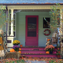 Front porch decorated for fall